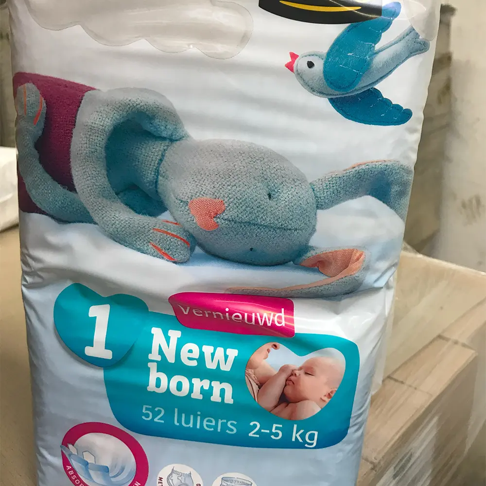 Package of newborn diapers for babies 2-5 kg with a stuffed blue bunny and a blue bird illustration on the front.