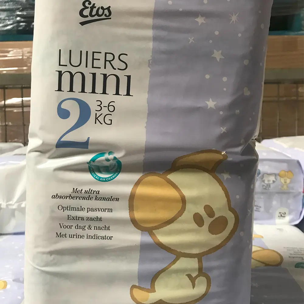 Package of Etos LUIERS mini size 2 diapers for babies 3-6 kg with a cartoon dog illustration and product features in Dutch.
