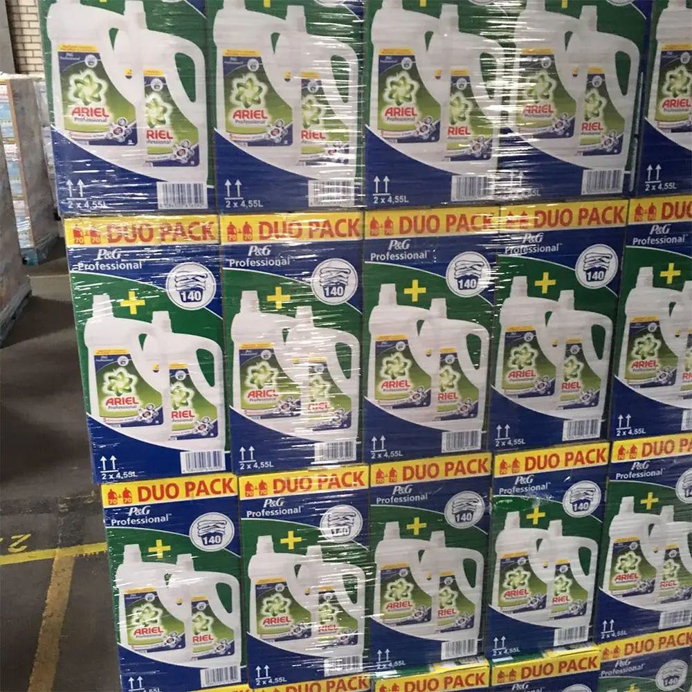 Stacked pallets of Ariel Professional laundry detergent duo packs wrapped in plastic.